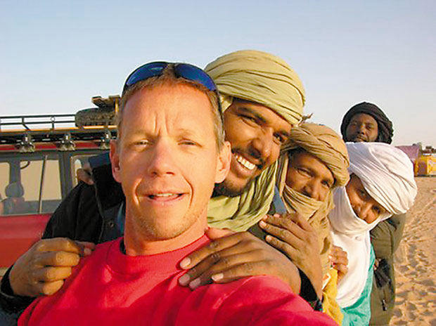 Engle takes time out with locals while filming his 2007 documentary Running the Sahara, narrated by Matt Damon.