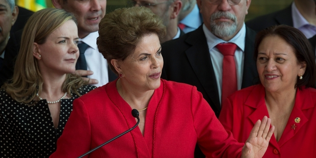 Dilma Rousseff vowed to return as she spoke to supporters outside the presidential residence after yesterday's decision. Picture / AP