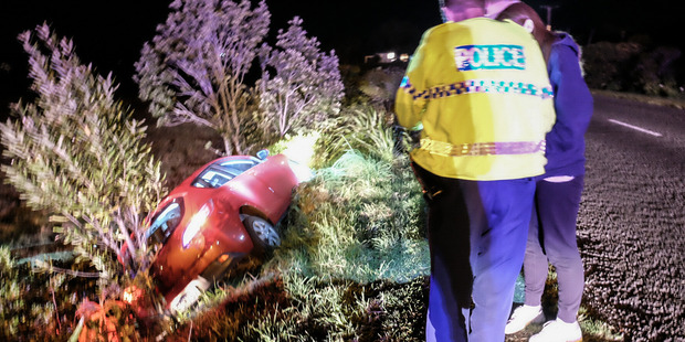 A car has driven into a ditch on Waihi Beach Rd. PHOTO/MELANIE CAMOIN