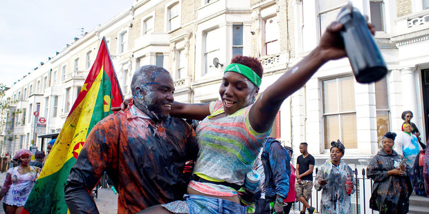 Revellers start the day's celebrations as Notting Hill Carnival begins. Photo / Getty