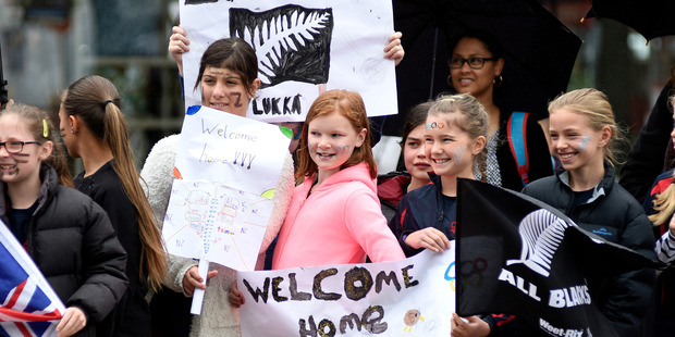 Inspired fans at the Olympic parade. Photo/George Novak