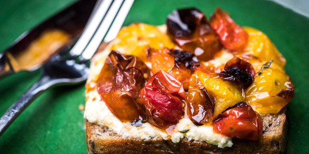 Blistered cherry tomatoes and ricotta on toast. Photo / Greg Bowker