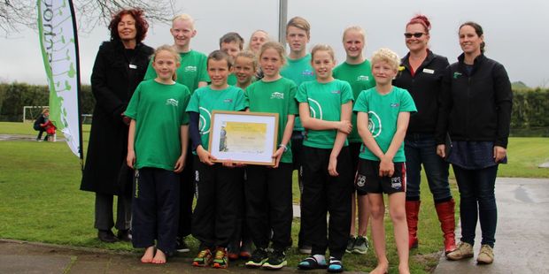 Toko School enviro-leaders pictured with the team from Taranaki Enviro-Schools with their award and new flag.