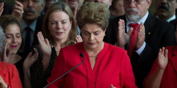 Brazil's ousted President Dilma Rousseff ends her address to supporters. Photo / AP