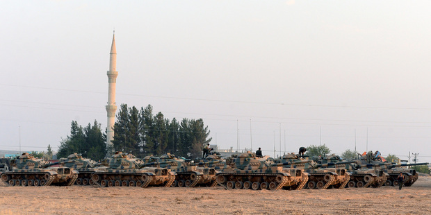 Turkish tanks stationed near the Syrian border, in Karkamis, Turkey. Photo / AP