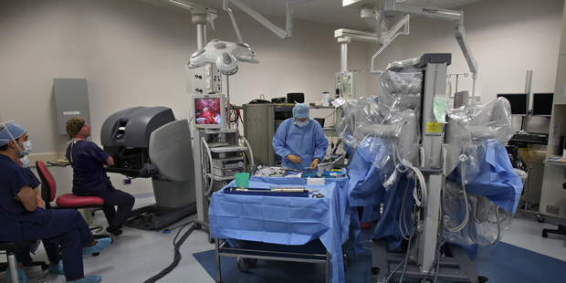 Surgery being done by a robot da Vinci robot. Photo / John Borren