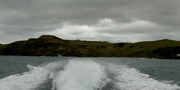 Two men had to be rescued after the commercial fishing boat they were on capsized off Pitt Island.