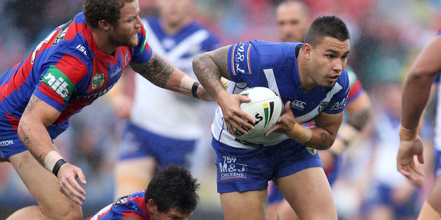 Michael Lichaa of the Bulldogs is tackled during the round 22 NRL match between the Newcastle Knights and the Canterbury Bulldogs. Photo / Getty