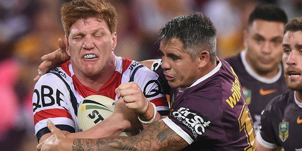 Dylan Napa of the Roosters is tackled by Corey Parker of the Broncos. Photo / Getty