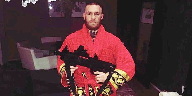 Conor McGregor poses with a shotgun. Photo / Instagram