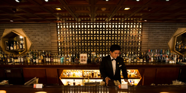 A bartender works inside the Old Imperial Bar. Photo / Tomohiro Ohsumi
