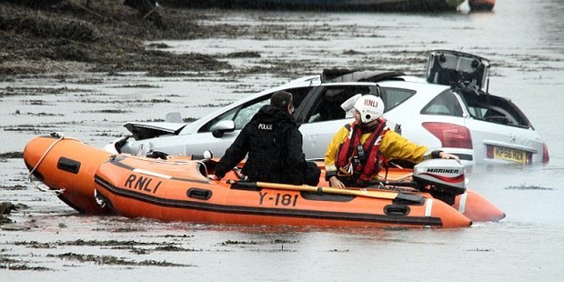 Police and emergency service attend the scene at Hooe Lake, Plymouth, Devon, in the UK.