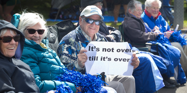 Jack Kildare, 77, leads his fellow rest home residents from Cambridge Resthaven as they cheer for Cambridge Middle School netball team at the 2016 AIMS Games. Photo / NZCT AIMS Games