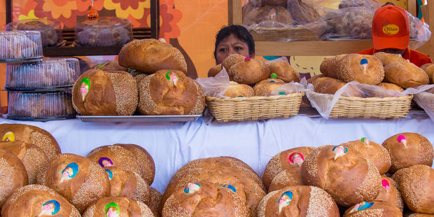 A women selling traditional 'Bread of the Dead' at the Oaxaca Market. Photo / 123RF