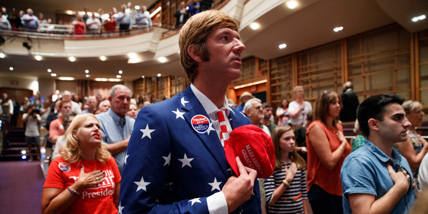Phil Capron of Virginia Beach, stands for the US national anthem before the start of a town hall with Republican presidential candidate Donald Trump. Photo / AP