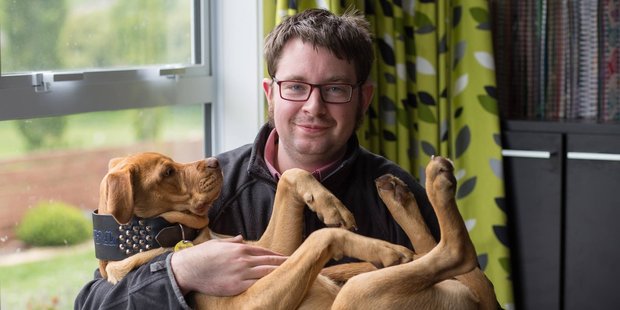 Dunedin photographer Riley Baker with dog Tank. Riley was killed in a car crash. Photo / Supplied