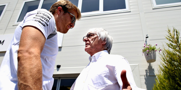 Formula 1 driver Nico Rosberg (L) talks to F1 supremo Bernie Ecclestone. Formula 1 has been sold to US company Liberty Media. Photo / Getty
