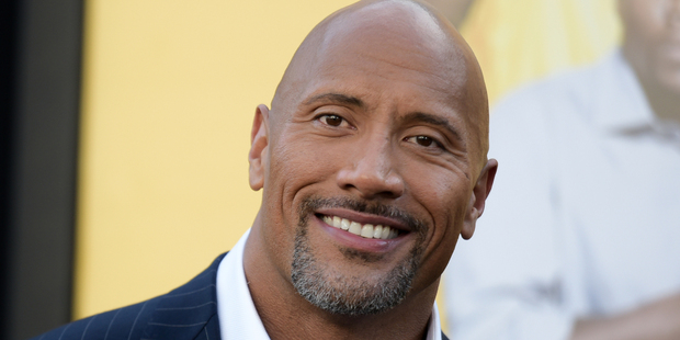 Dwayne "The Rock" Johnson has posted a photo of the exact moment his eight-month-old daughter poo'ed on him. Photo / AP