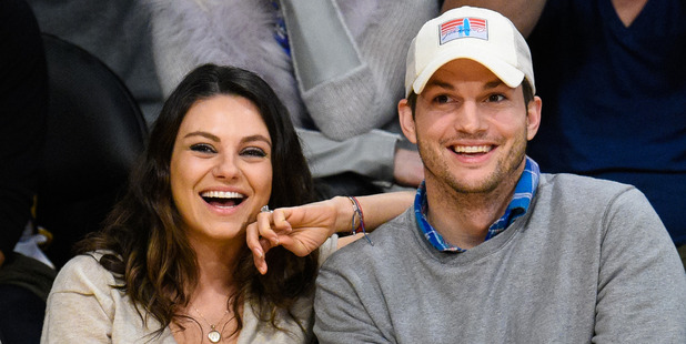 Mila Kunis and Ashton Kutcher - from first kiss to married couple. Photo / Getty Images.
