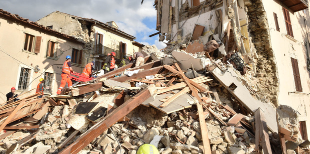 Rescuers clear debris in Arquata del Tronto, Italy. Photo / Getty Images