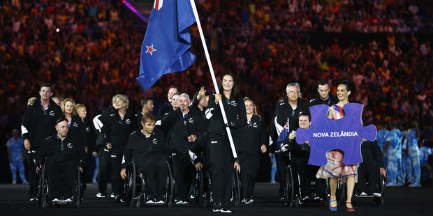 Flag bearer Holly Robinson of New Zealand leads the team entering the stadium during the Opening Ceremony of the Rio 2016 Paralympic Games. Photo / Getty