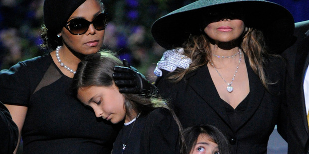 (L-R) Singer Janet Jackson, Paris Jackson, Prince Michael II and La Toya Jackson appear on stage at the Michael Jackson public memorial service held at Staples Center. Photo / Getty