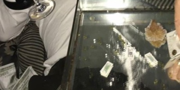 Attendees play with the fake cocaine on a tray. Photo / Supplied