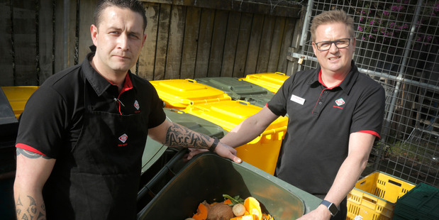 New World produce manager Luke Archibald, left, with owner John Kelly and some of the waste from the store that goes to pigs. PHOTO/BEVAN CONLEY