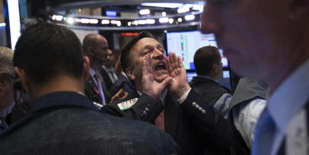 Traders work on the floor of the New York Stock Exchange. Photo / AP
