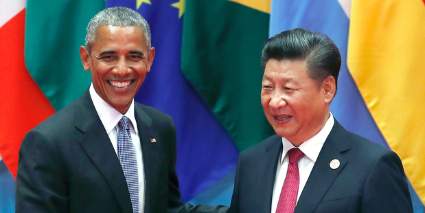 U.S. President Barack Obama, left, shakes hands with China's President Xi Jinping. Photo / AP