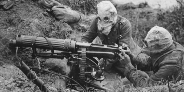 Allied machine gunners wearing gas helmets near Ovillers, in the Battle of the Somme, in July 1916. Photo / Imperial War Museum