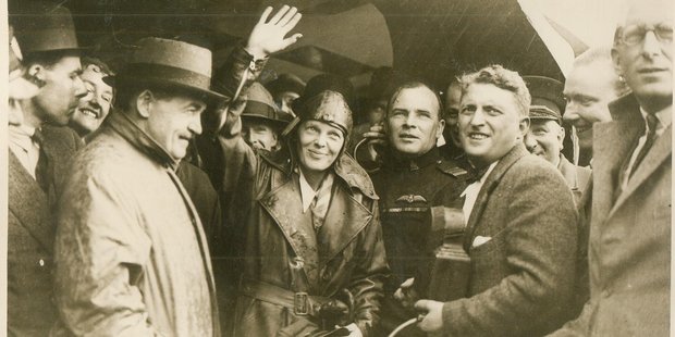 Earhart waves to a crowd gathered at Hanworth England May 22, 1932, after flying across the Atlantic Ocean from America. Photo / Keystone