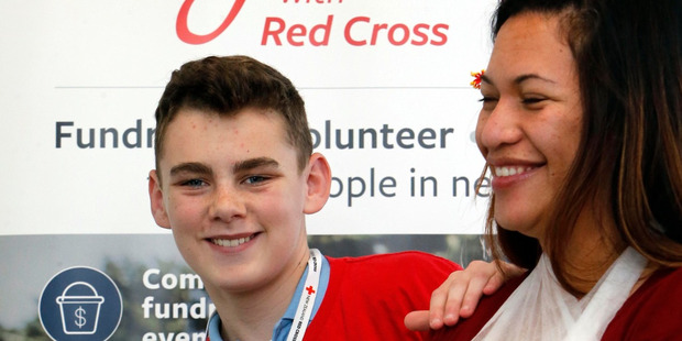 Jack Randall practises his first aid skills on Red Cross Northland community services' manager Nancy Kareroa-Yorke. Photo / John Stone