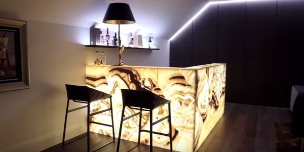The yellow marble bar which Louise Wallace tore apart in an episode of Real Housewives. Photo / Barfoot & Thompson