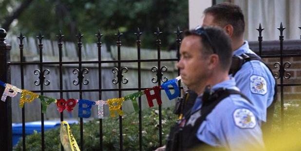 A 'Happy Birthday' sign hangs outside a residence near the scene of a shooting in Chicago over the Labor Day weekend. Photo / AP
