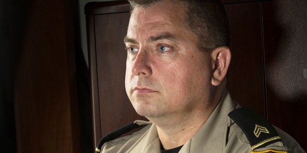 Sgt. James Spurlock leads an outreach session for the sheriff's office on the dangers of cyberbullying and online sexual exploitation. Photo / Nikki Kahn, The Washington Post