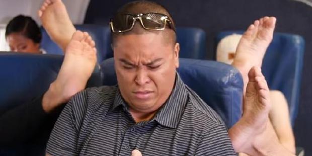If you've ever flown economy class, you'll know the struggle is very, very real. Photo / Youtube
