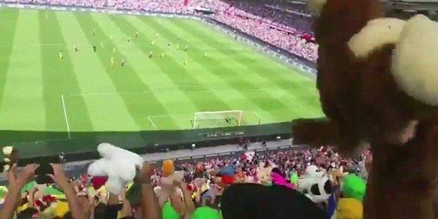 Fans from football club Den Haag bombard Feyenoord supporters with teddy bears at today's the Dutch Eredivisie. Photo / Twitter