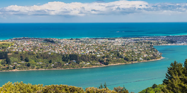 Dunedin City in the middle of Otago Harbour and the Pacific Ocean. Photo / 123RF