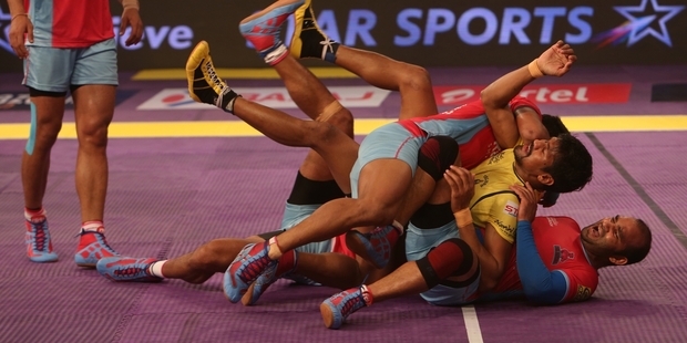The combat sport of kabaddi is a big hit on TV in India and elsewhere. Photo / AP