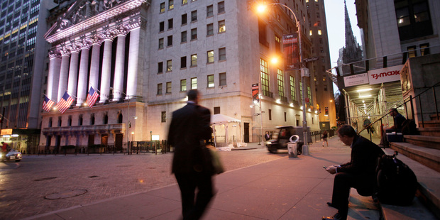 Global stock markets tumbled as investors fretted in part over Hillary Clinton's health news. Photo / AP