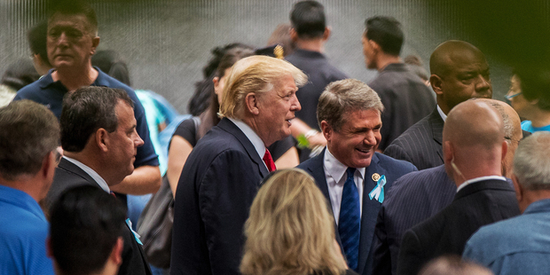 Republican Presidential Candidate Donald Trump, centre, with Congressman Michael McCaul. Photo / AP