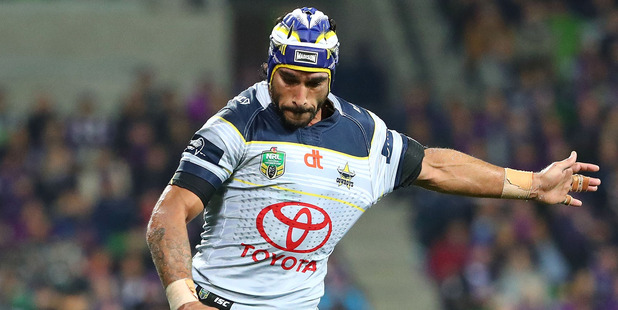 Cowboys playmaker Johnathan Thurston takes a shot at goal during their 16-10 qualifying final match against the Melbourne Storm last night. Photo / Getty Images