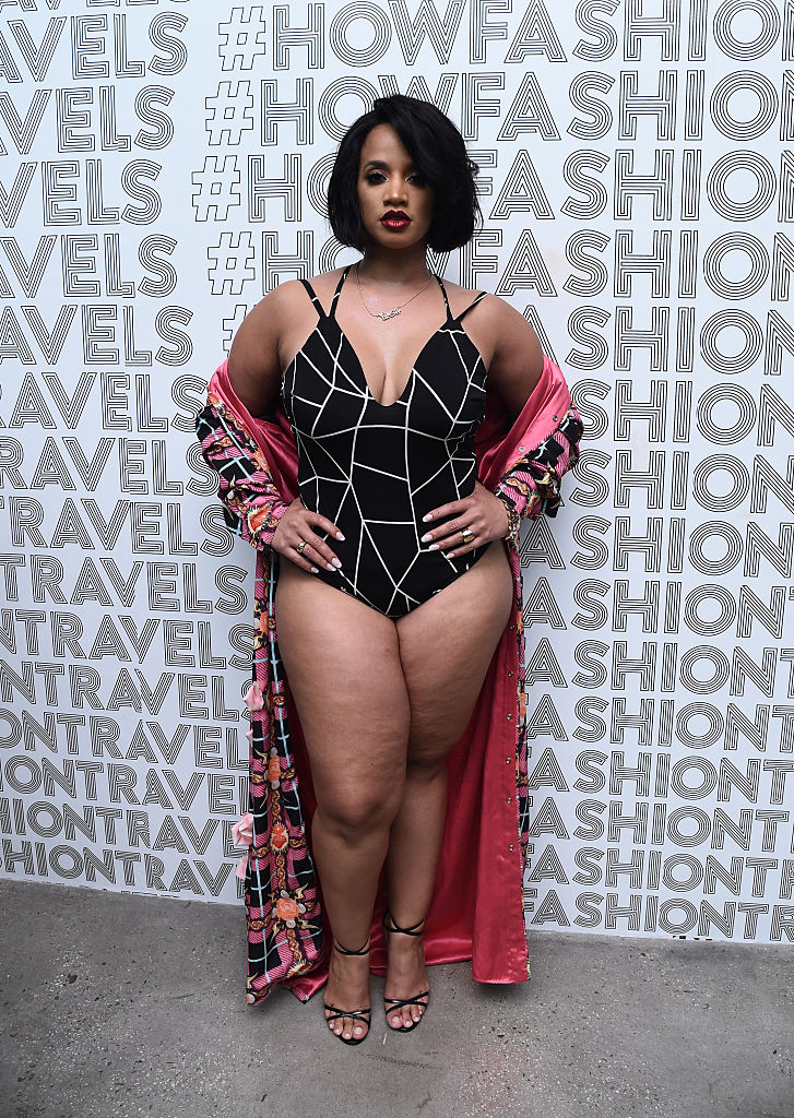Dascha Polanco strutted her stuff on day five of Fashion Week in nothing but a one-piece swimsuit, teamed with a long, open jacket and a pair of high heels. Photo / Getty Images