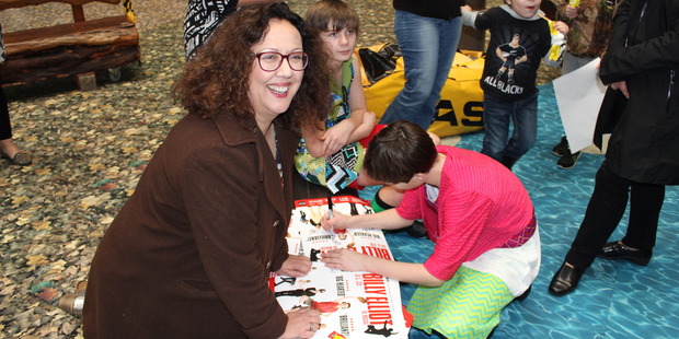 Rima Te Wiata signing Billy Elliot posters at Starship Hospital in Auckland. Photo / Supplied