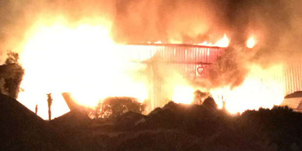 A building is engulfed in flames at Franz Josef in South Island. Photo / Supplied