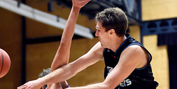 TIGHT TUSSLE: Action from NZ Breakers v Adelaide Bullets at ASB Arena. Photo: George Novak