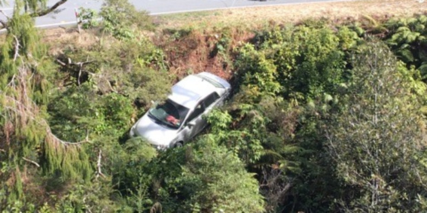 Three people have been rescued from a rental car which went over a cliff south of Westport. Photo / Westport News