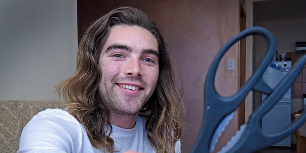 William Moore is shaving off his hair for his cousin Sativa. Photo/George Novak