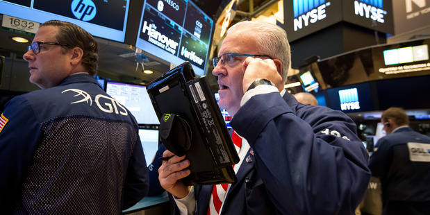 Traders work on the floor of the New York Stock Exchange. Photo / AP